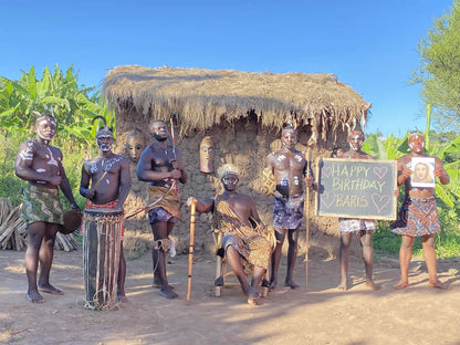 Hunters Team traditional african birthday video performers in tribal attire filmed in Zambia