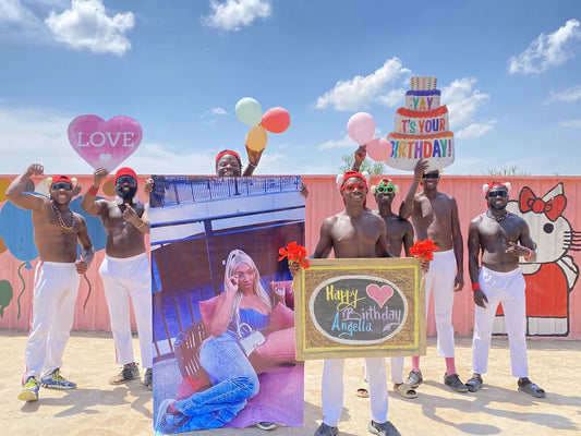 Fitness Team dancers holding couple's photo during wedding video performance